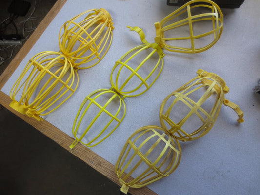 MIXED LOT of TROUBLE LIGHT REFLECTOR GUARDS, YELLOW PLASTIC, NEW - LOT of 250